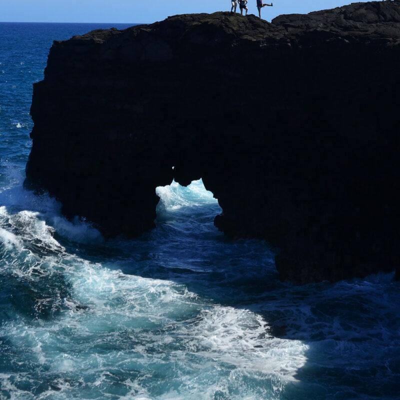 people having fun at the top of chain of craters in hawaii